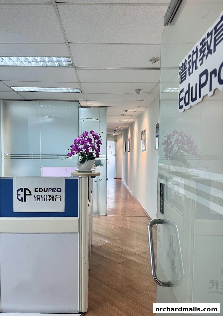 Interior view of Edupro Pte. Ltd. with a reception desk and a hallway.