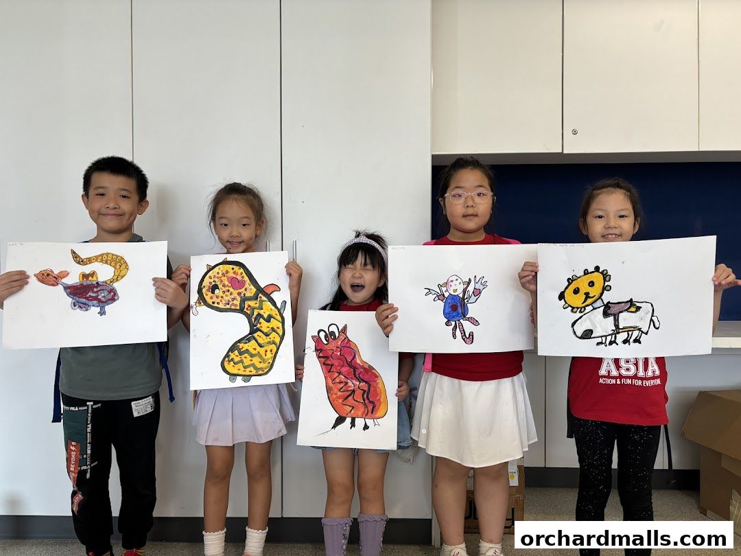 Children proudly display their colorful monster drawings at Edupro Pte. Ltd.