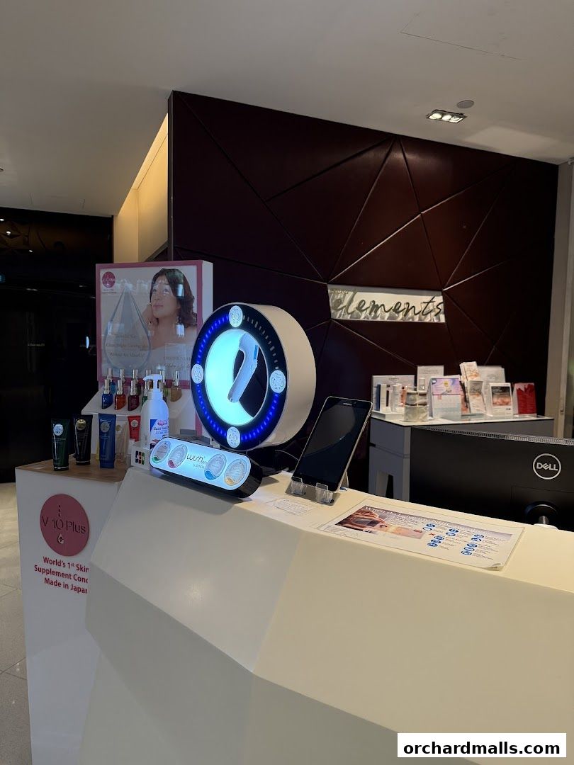 A counter display at Elements ION Orchard featuring skincare products and promotional materials.