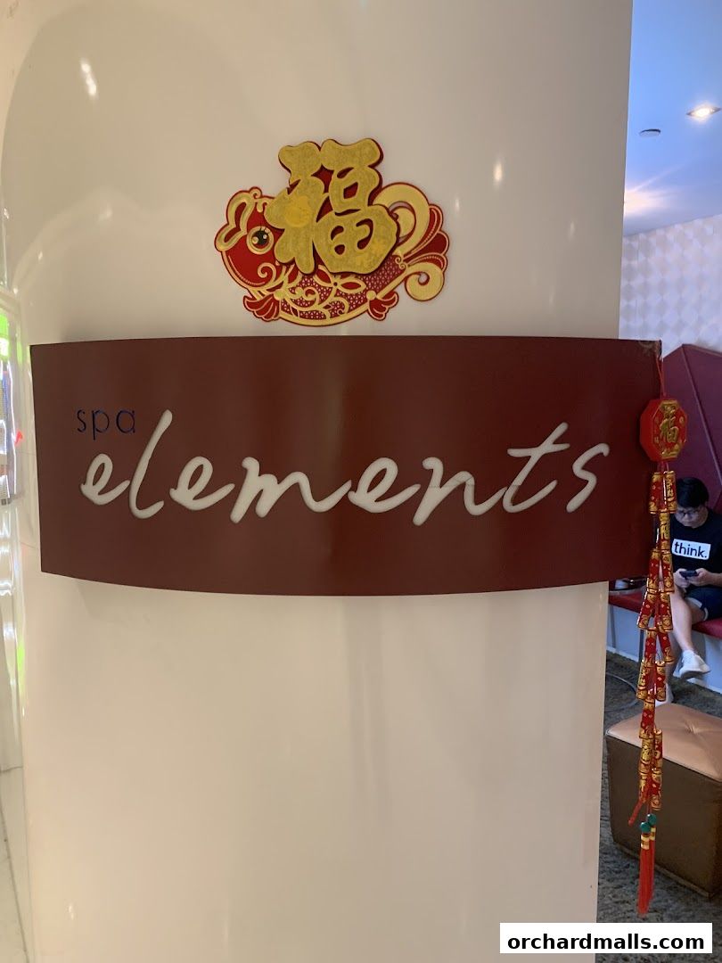 A sign for 'spa elements' with Chinese New Year decorations.