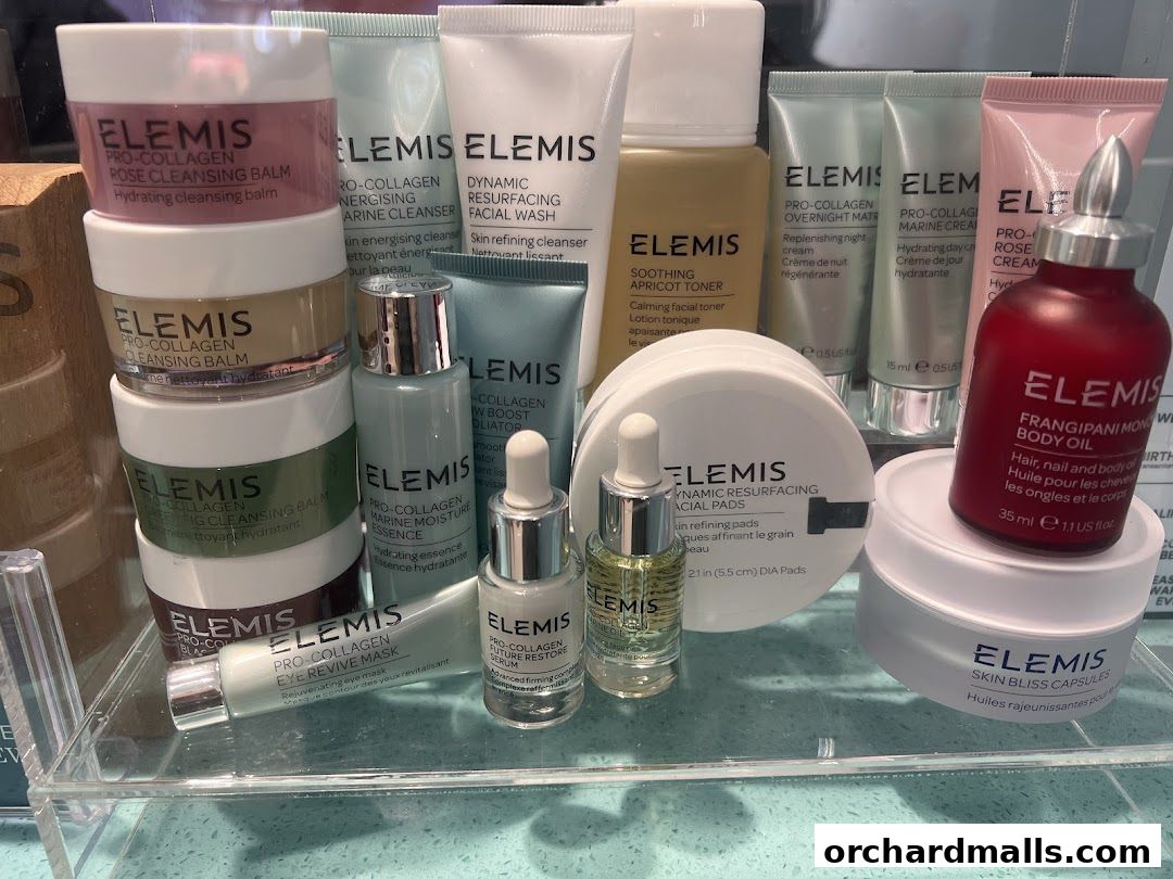 A collection of Elemis skincare products, including cleansers, toners, serums, and body oil.