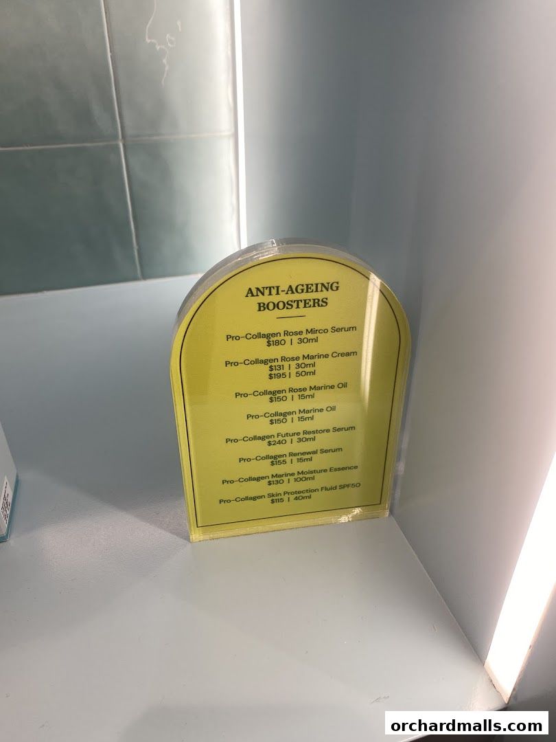 A sign displaying anti-aging skincare products and their prices from Elemis London.