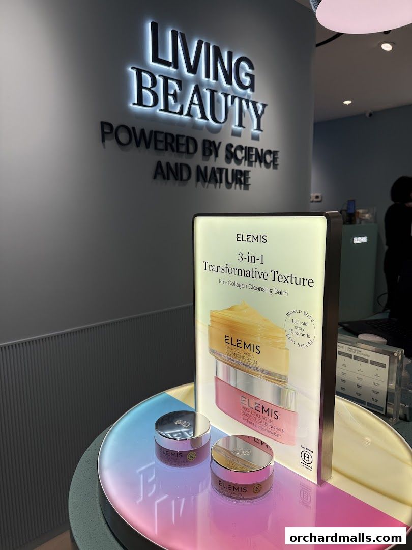 Elemis London shop display featuring Pro-Collagen Cleansing Balm and other skincare products.