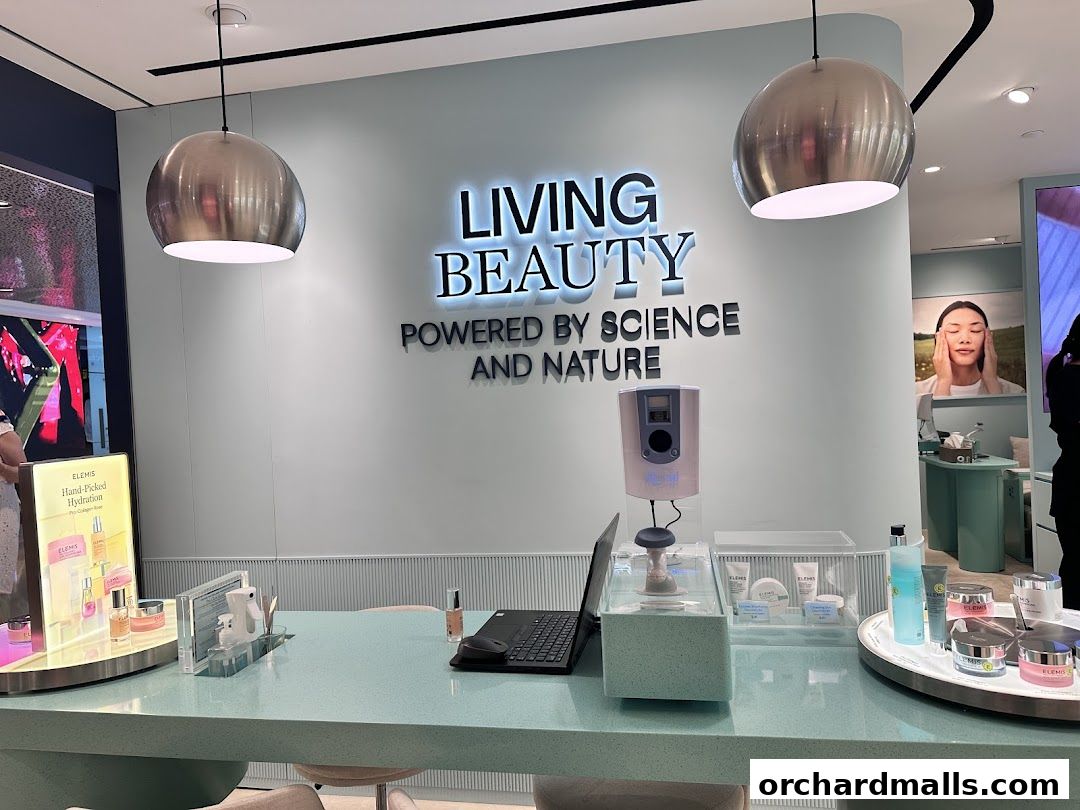 Elemis London shop interior with skincare products displayed on a counter and a 'Living Beauty' sign.