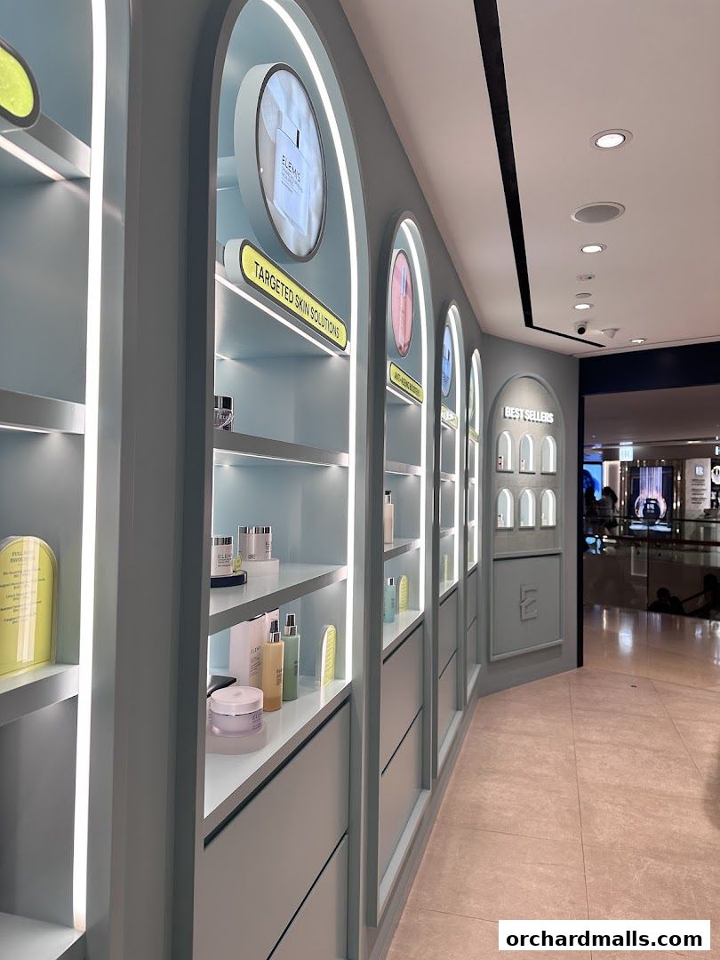 Interior view of an Elemis London shop showcasing skincare products on illuminated shelves.