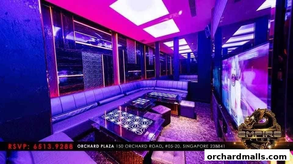 Luxurious KTV room with plush seating, modern decor, and vibrant lighting.