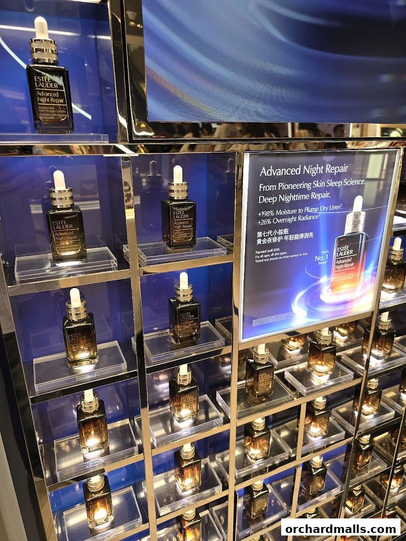 Estée Lauder Advanced Night Repair serum displayed in a well-lit retail store.