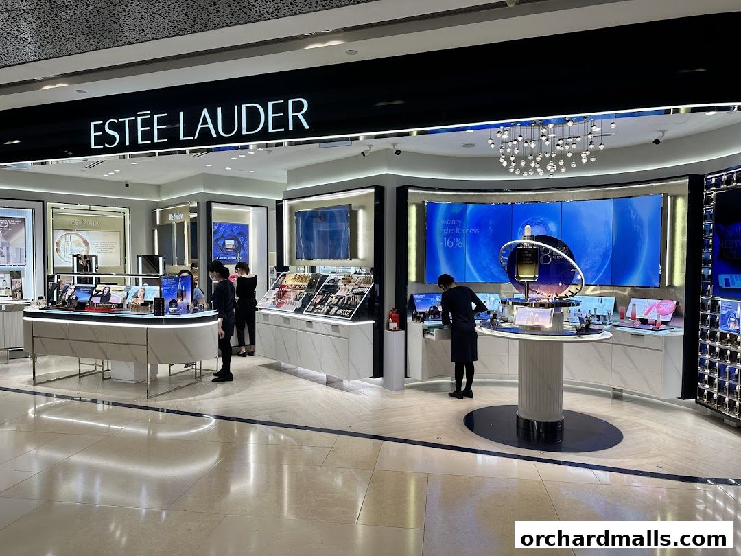 The Estée Lauder store at ION Orchard showcases a modern, well-lit interior with product displays and staff.