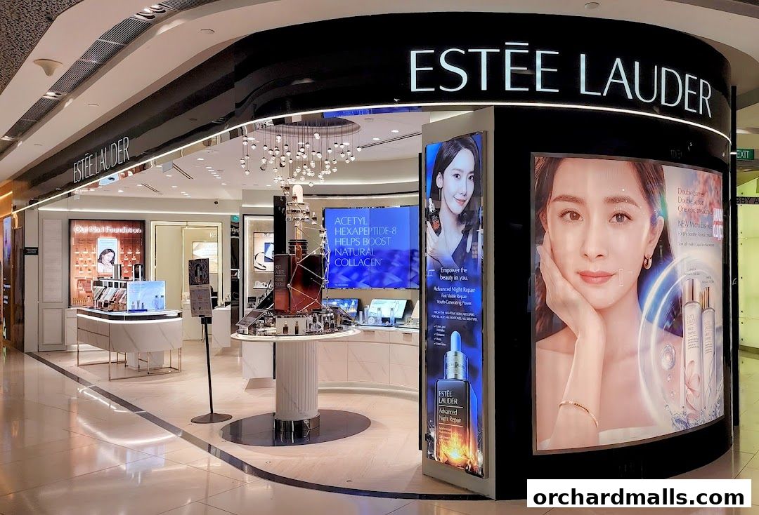 Interior view of an Estée Lauder store showcasing beauty products and promotional displays.