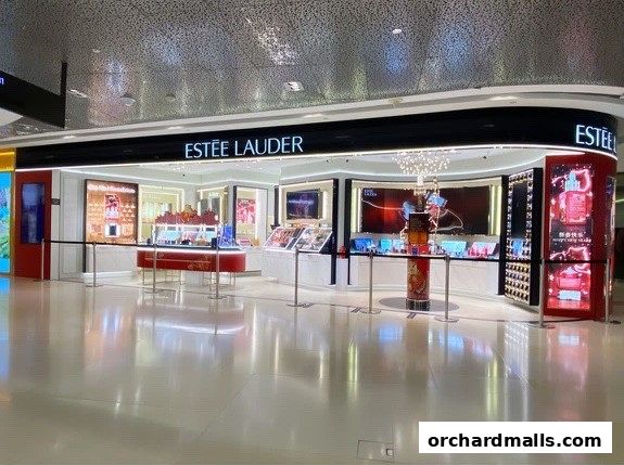 The Estée Lauder store at ION Orchard features a modern, well-lit interior with displays of beauty products.