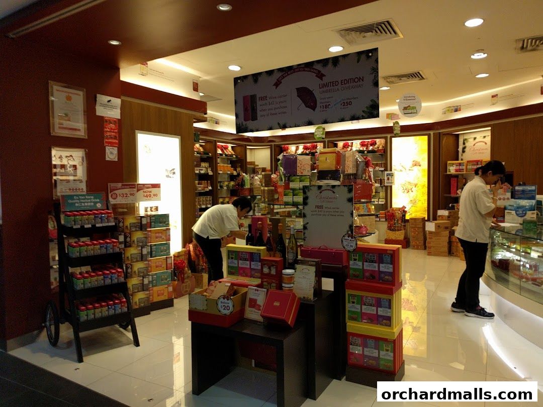 Interior of a Eu Yan Sang shop with products displayed and customers browsing.