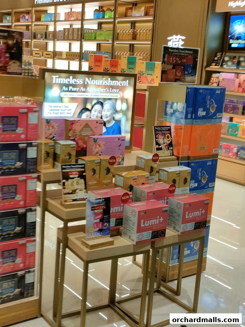 Eu Yan Sang shop display featuring health products and a Mother's Day promotion.