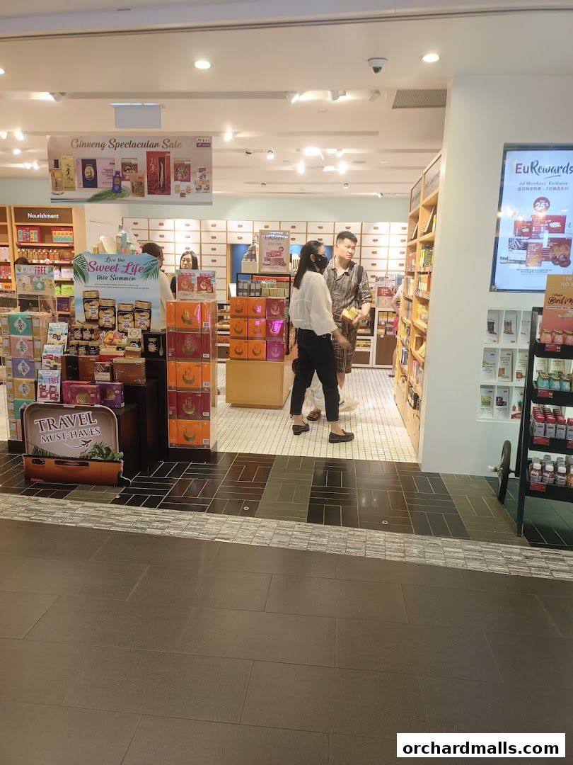 Interior view of Eu Yan Sang shop with customers and product displays.