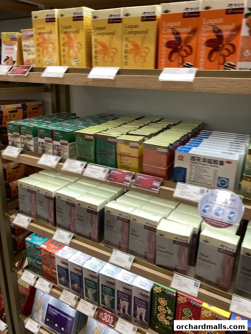 Shelves stocked with various traditional Chinese medicine products and health supplements.