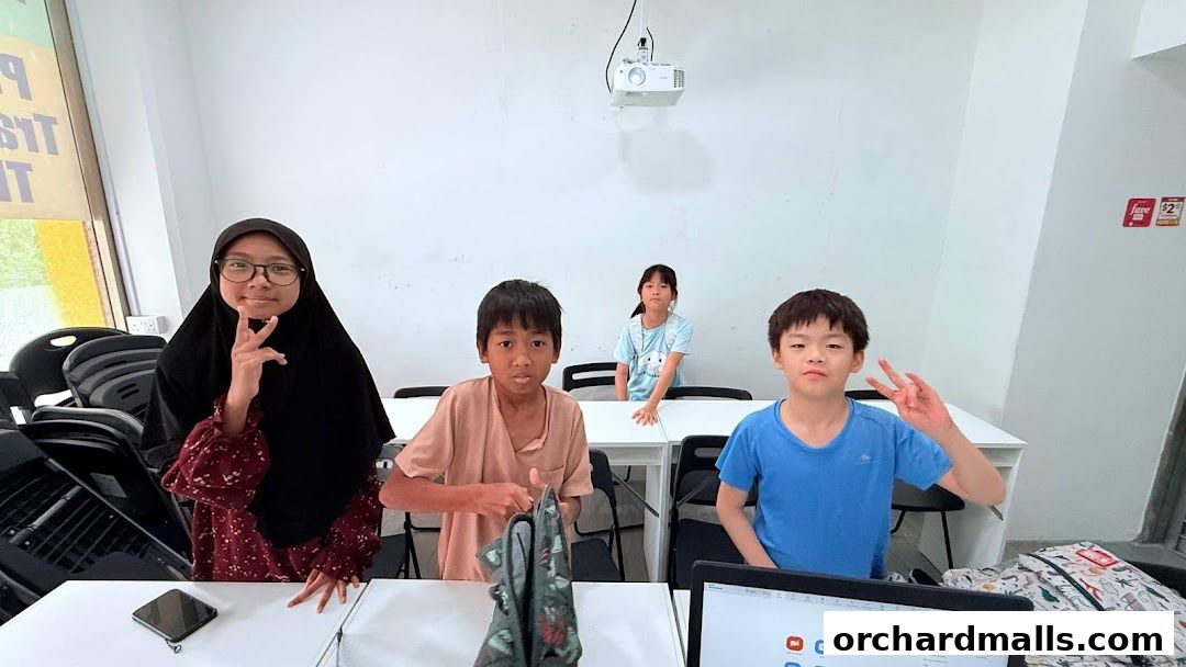 Children posing in a classroom setting at Everyday Tuition.