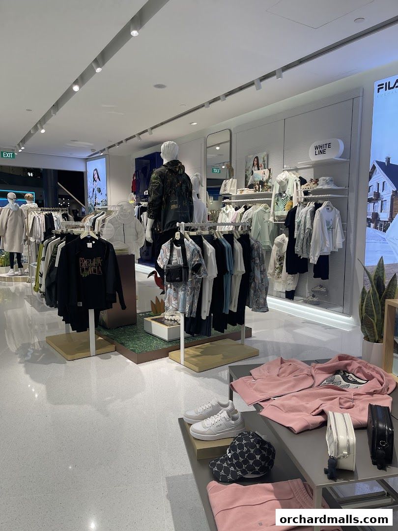 Interior view of a Fila store showcasing apparel, shoes, and accessories on display.