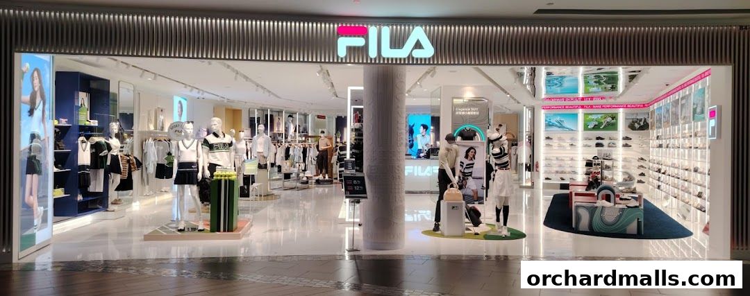 The FILA ION ORCHARD store features a modern, well-lit interior with mannequins displaying apparel and shelves stocked with footwear.