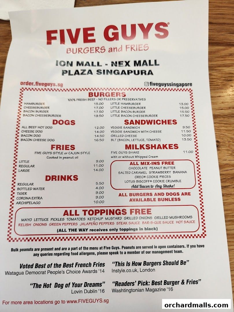 A Five Guys menu featuring burgers, hot dogs, fries, milkshakes, and drinks with prices.