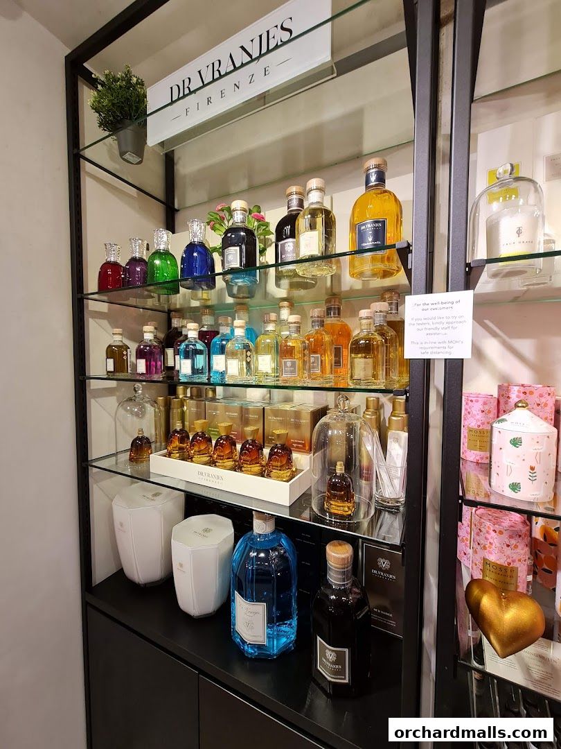 A display shelf filled with various sizes and colors of Dr. Vranjes Firenze fragrance bottles.