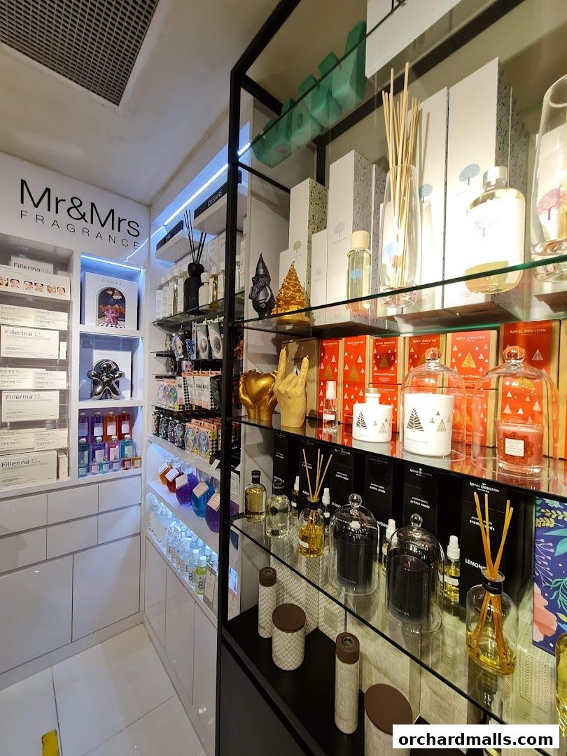 A retail shop interior displaying various fragrances, diffusers, and decorative items.