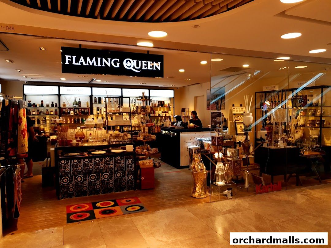 The exterior of the Flaming Queen shop, showcasing a variety of home fragrance and decor items.