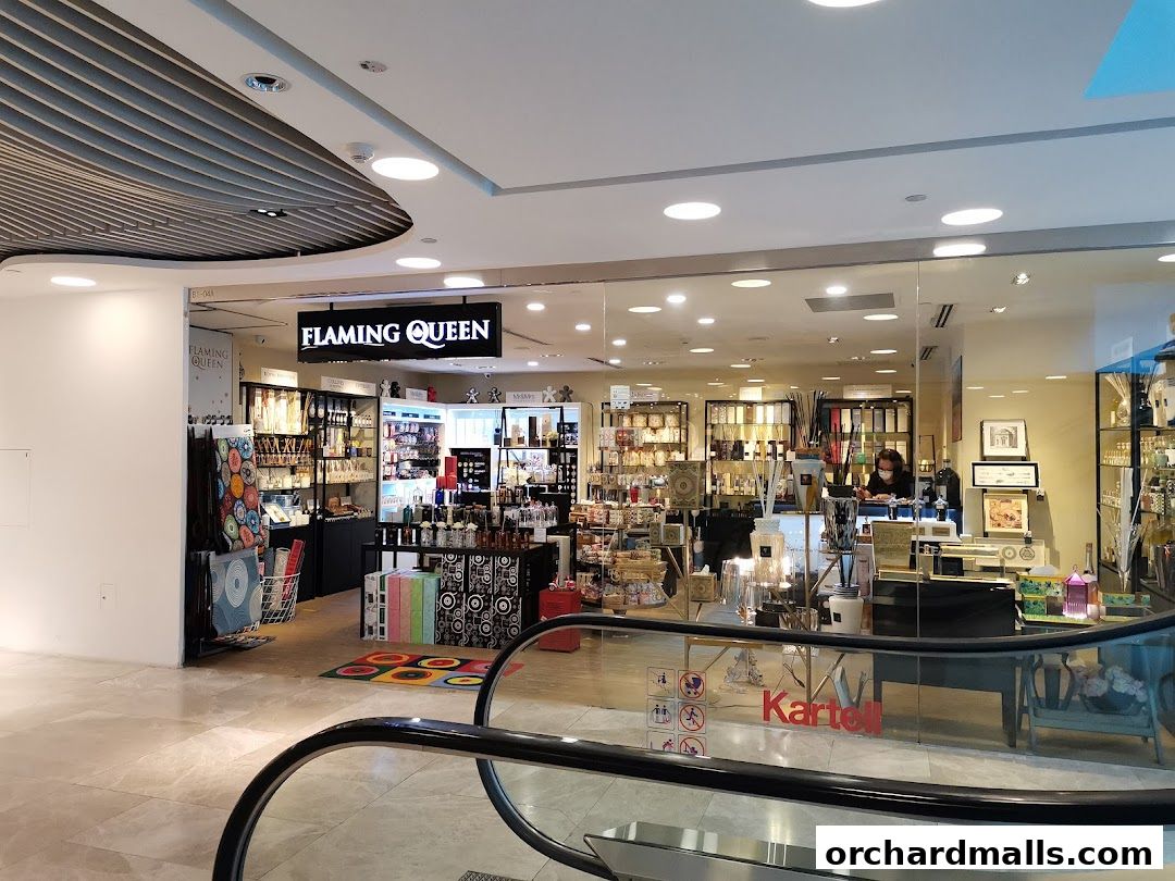 The exterior of the Flaming Queen shop, showcasing a variety of home fragrance and decor items.