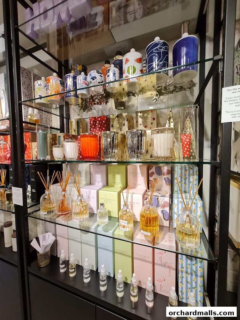 Shelves filled with decorative candles, diffusers, and gift items.