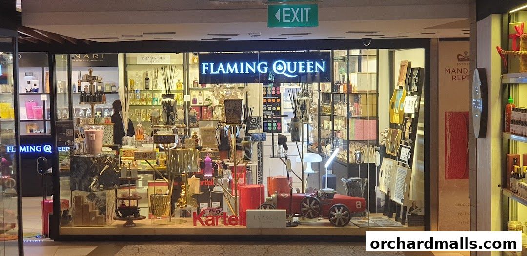 Flaming Queen shop front displaying various perfumes, diffusers, and decorative items.