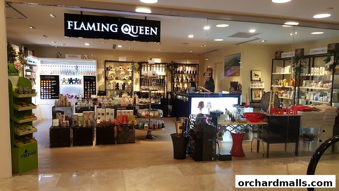 The Flaming Queen shop front displays a wide array of home fragrances, candles, and decorative items.