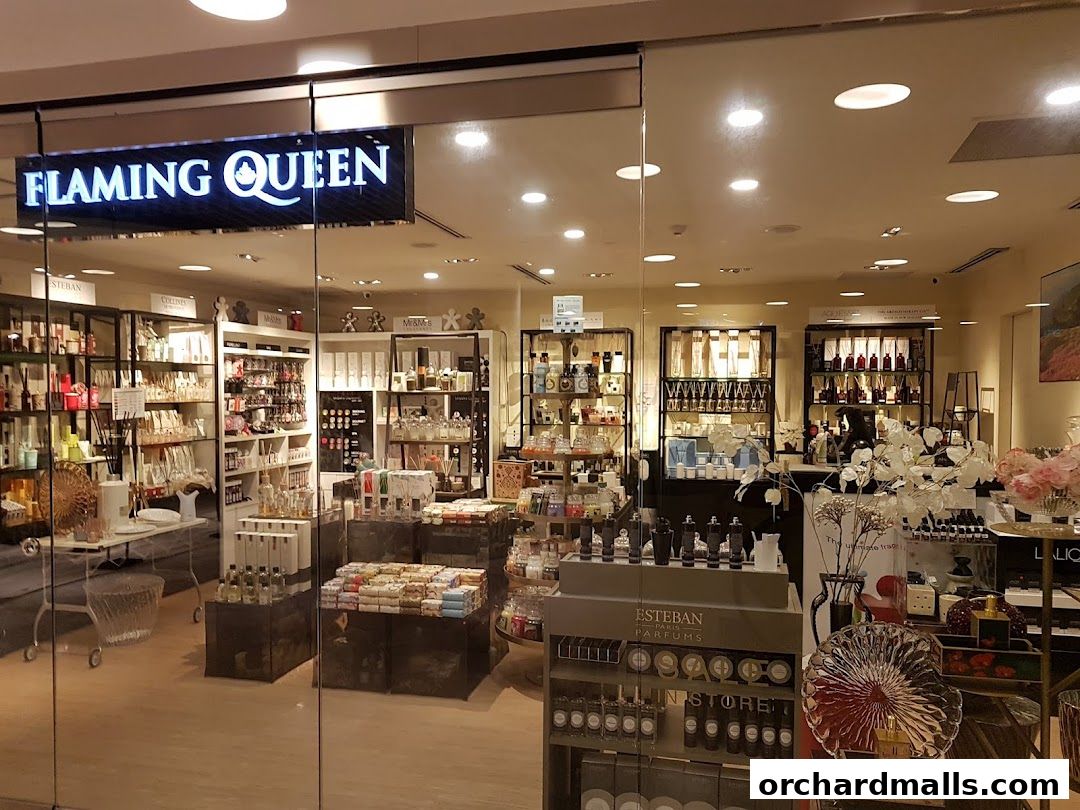 The exterior of the Flaming Queen shop, showcasing a wide array of perfumes and home fragrances.