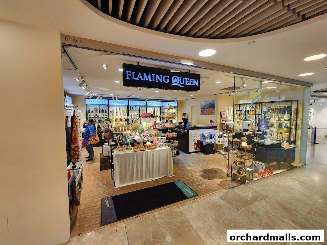 The exterior of the Flaming Queen shop, showcasing a variety of products and a welcoming display.
