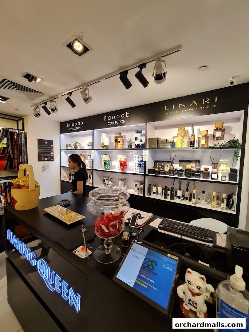 Interior of a fragrance shop with a counter, display shelves, and products.