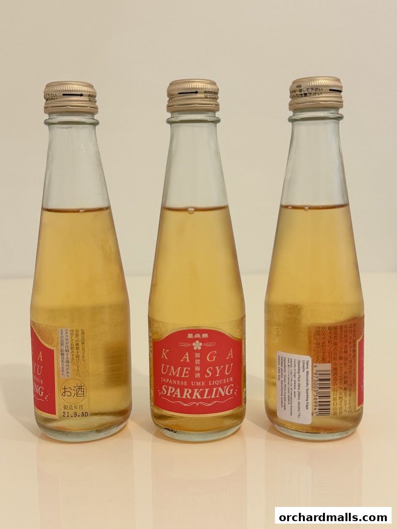 Three bottles of Kaga Umesyu Sparkling Japanese Ume Liqueur.