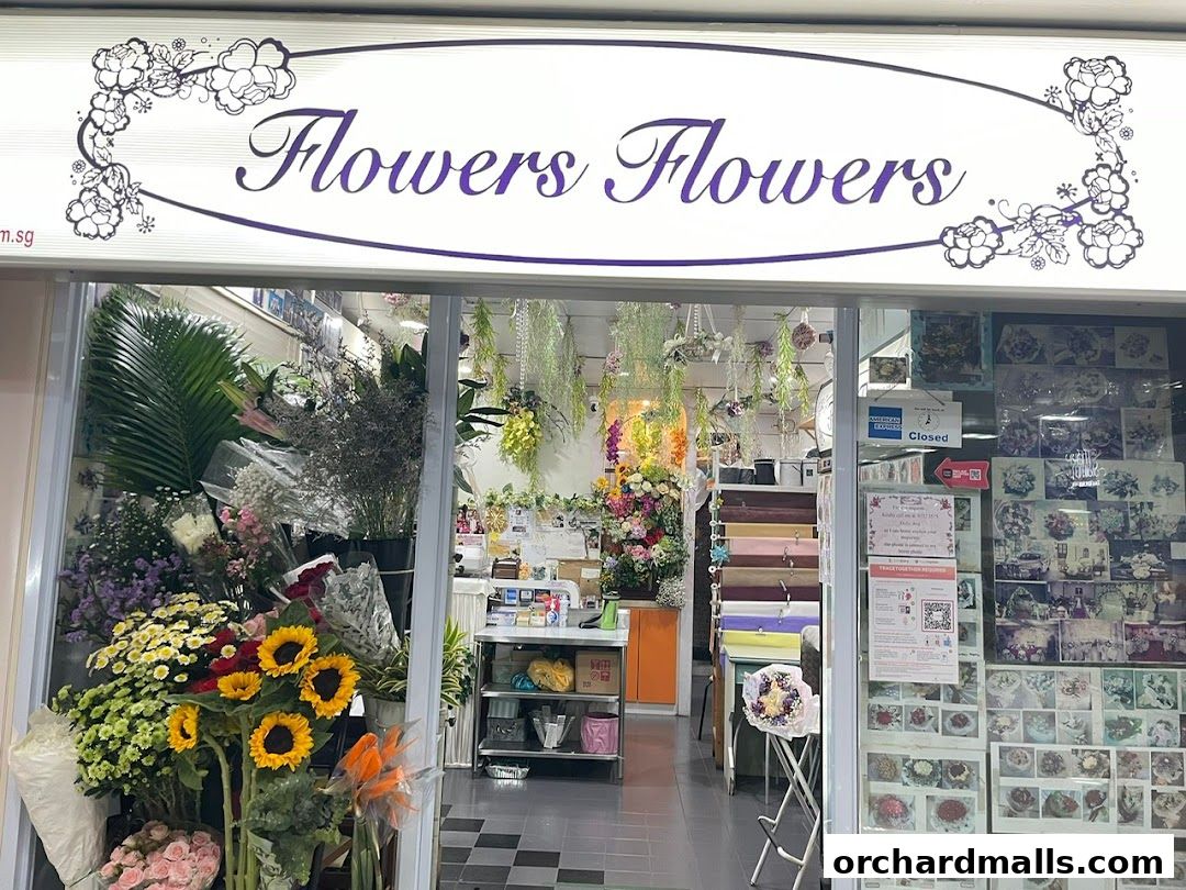 A flower shop with a wide variety of fresh flowers and arrangements displayed.