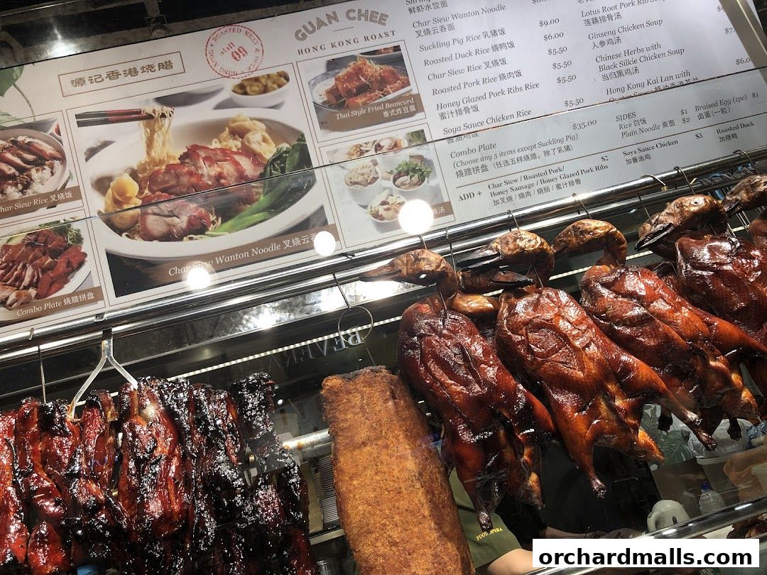A display of roasted meats and menu items at a Hong Kong-style roast meat shop.