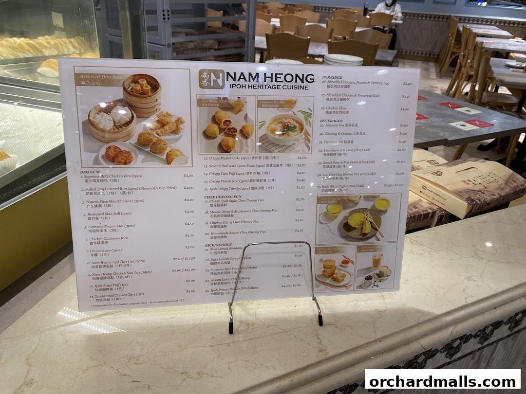 A menu from Nam Heong Ipoh Heritage Cuisine featuring dim sum, porridge, rice, noodles, and beverages.