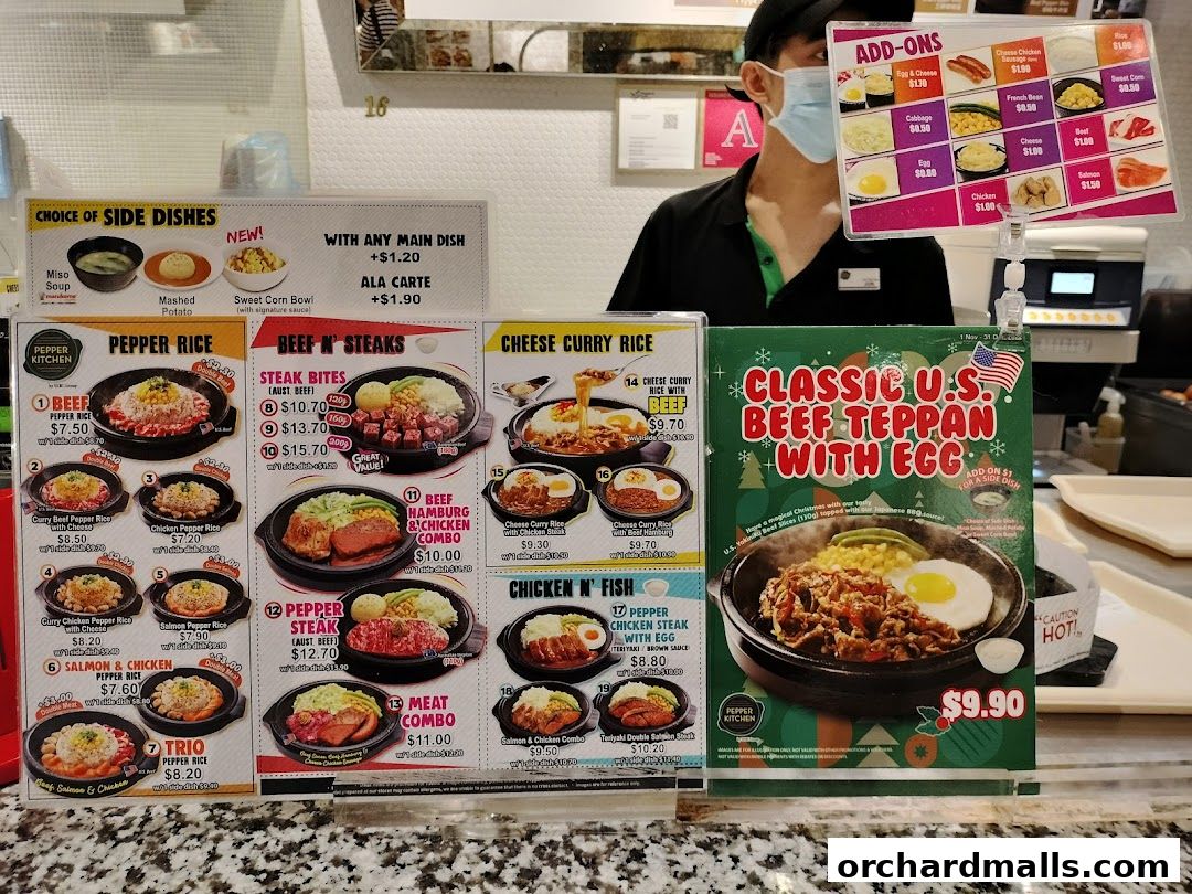 A display of Pepper Kitchen's menu items, featuring various rice dishes, steaks, and combos.