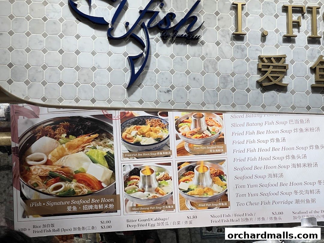 A menu board displays various seafood soup dishes with images and prices.