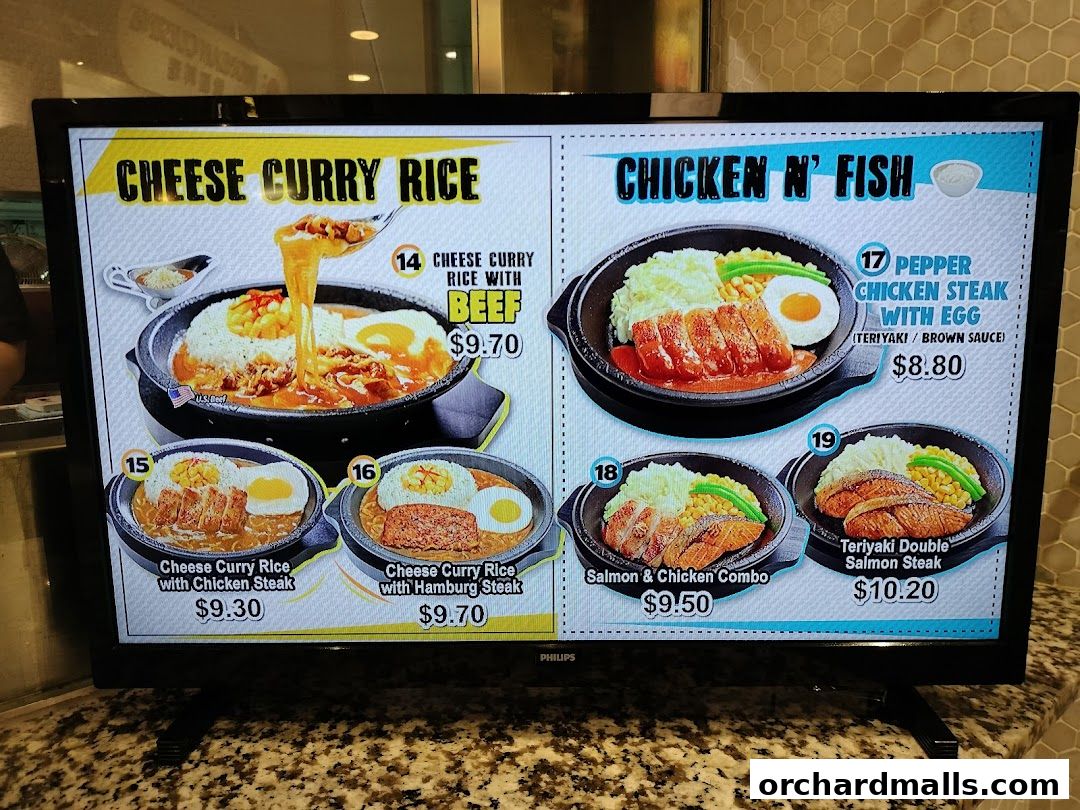 A digital menu displaying various rice and steak dishes with prices.
