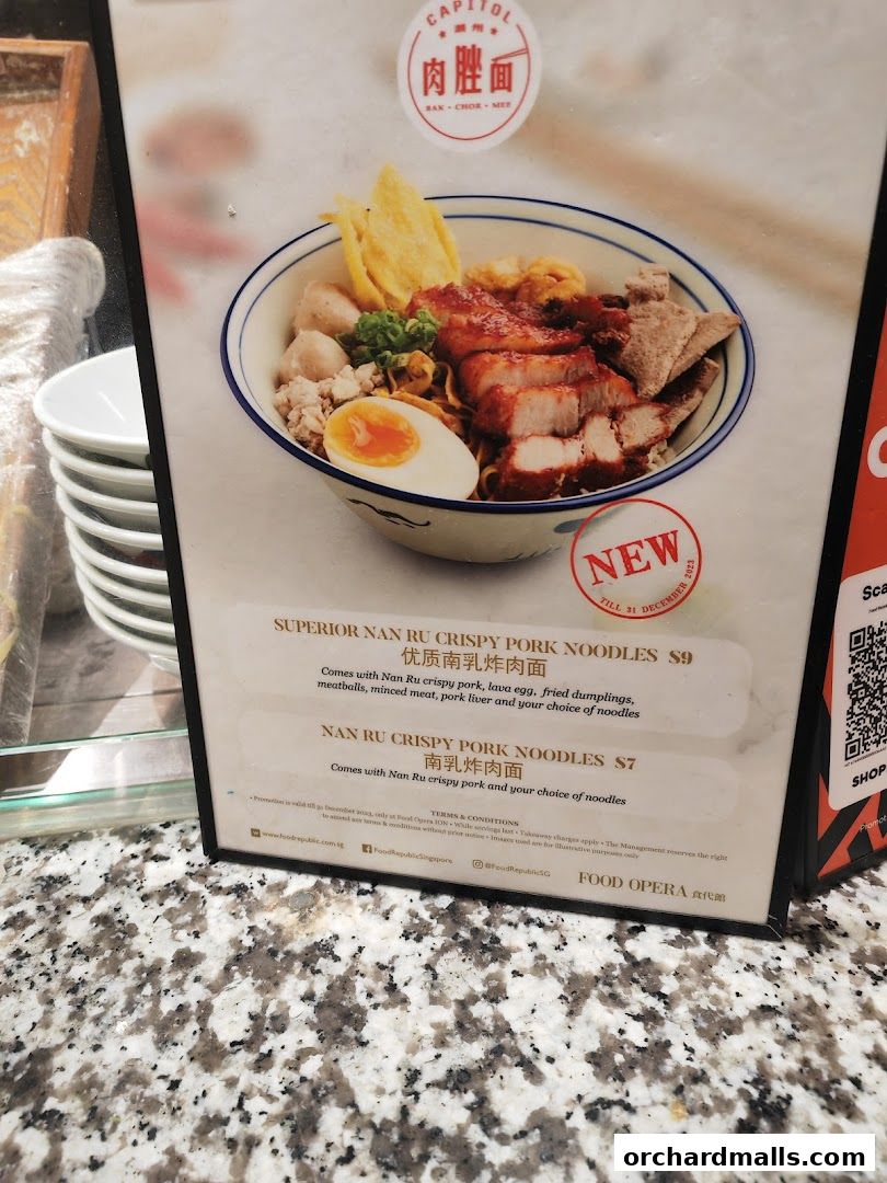 A menu board for Food Opera featuring crispy pork noodles with detailed descriptions and prices.