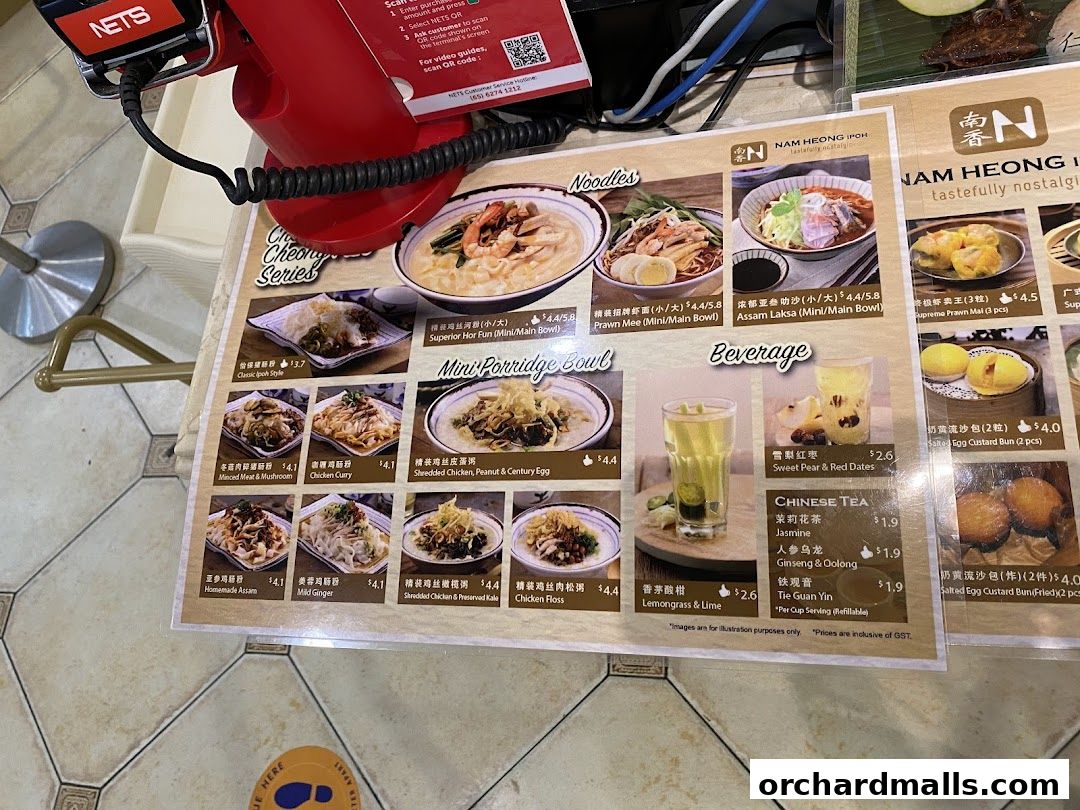 A menu from Nam Heong Ipoh featuring noodles, porridge, and beverages with prices.