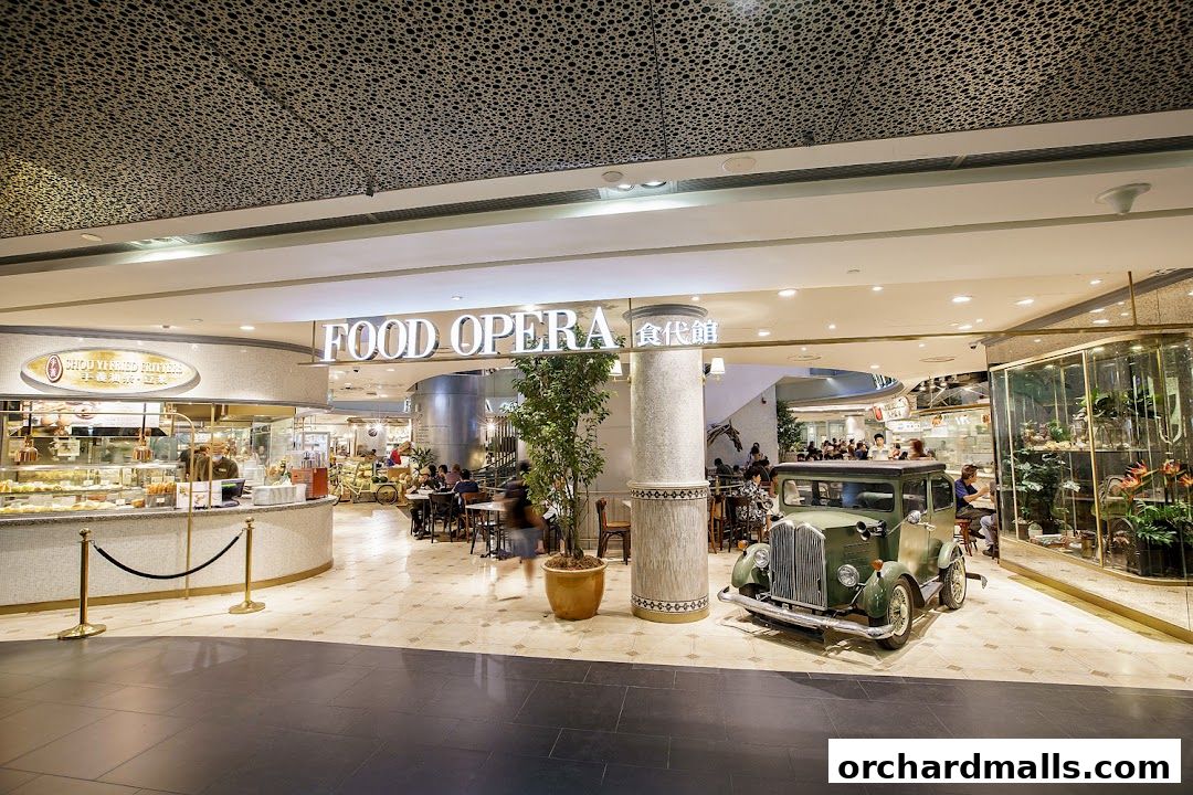 The Food Opera shop front features a vintage car, seating area, and a display of food items.