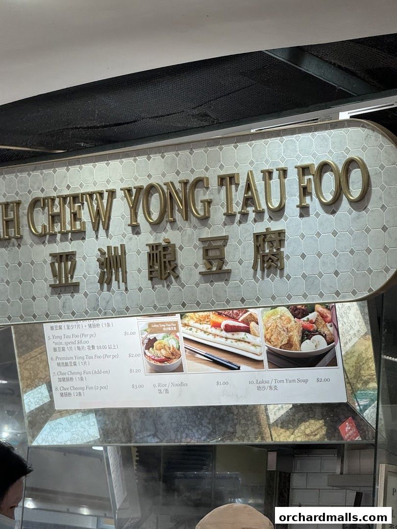 A menu board for Yong Tau Foo, featuring various dishes and prices.