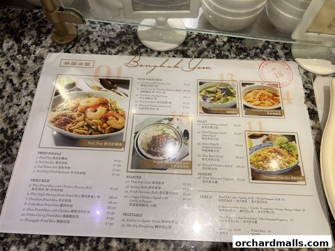 A menu from Bangkok Yam featuring Thai dishes like Pad Thai, Green Curry, and Tom Yum soup.