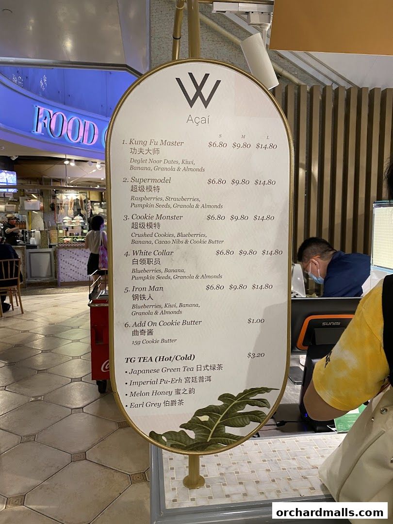A menu board for Acai bowls and TG Tea at Food Opera.