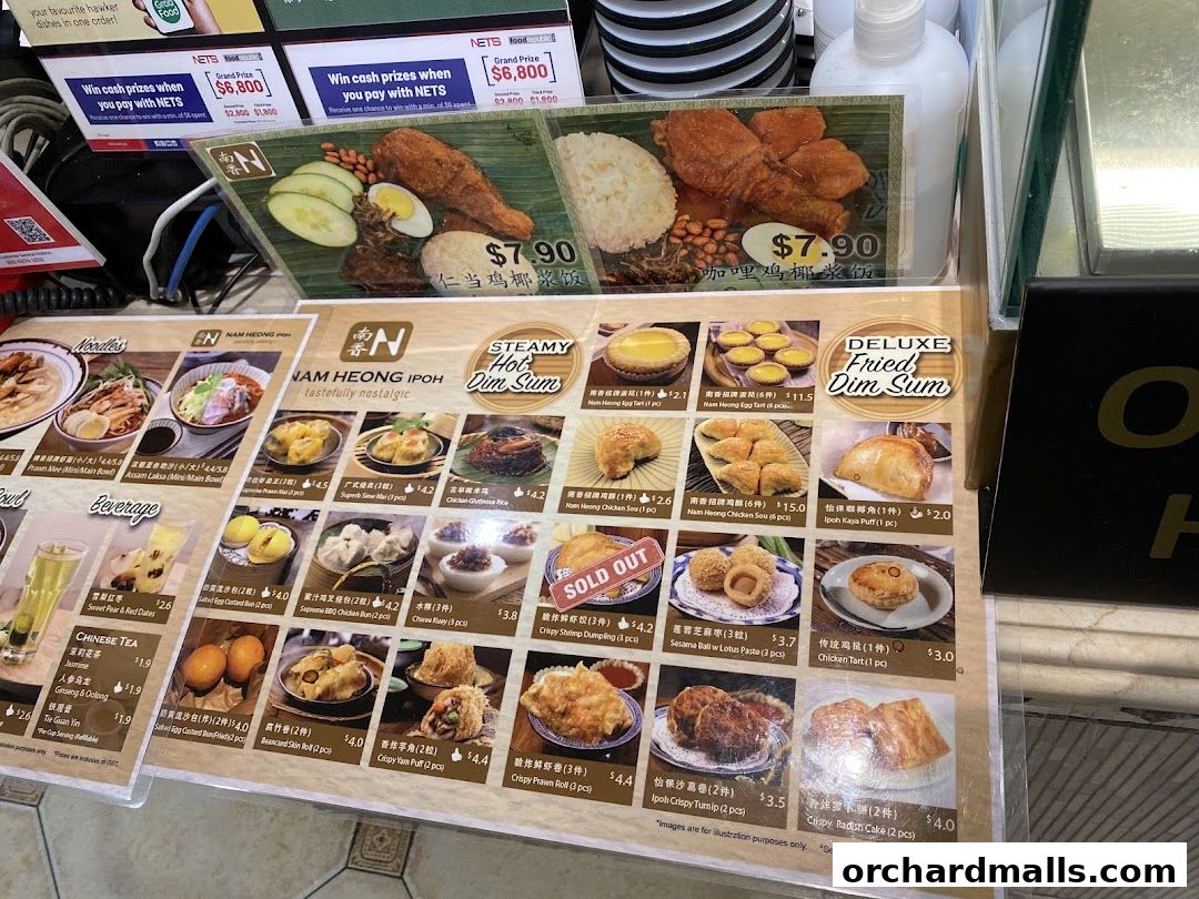 A menu display for Nam Heong Ipoh, featuring various dim sum, noodles, and beverages.