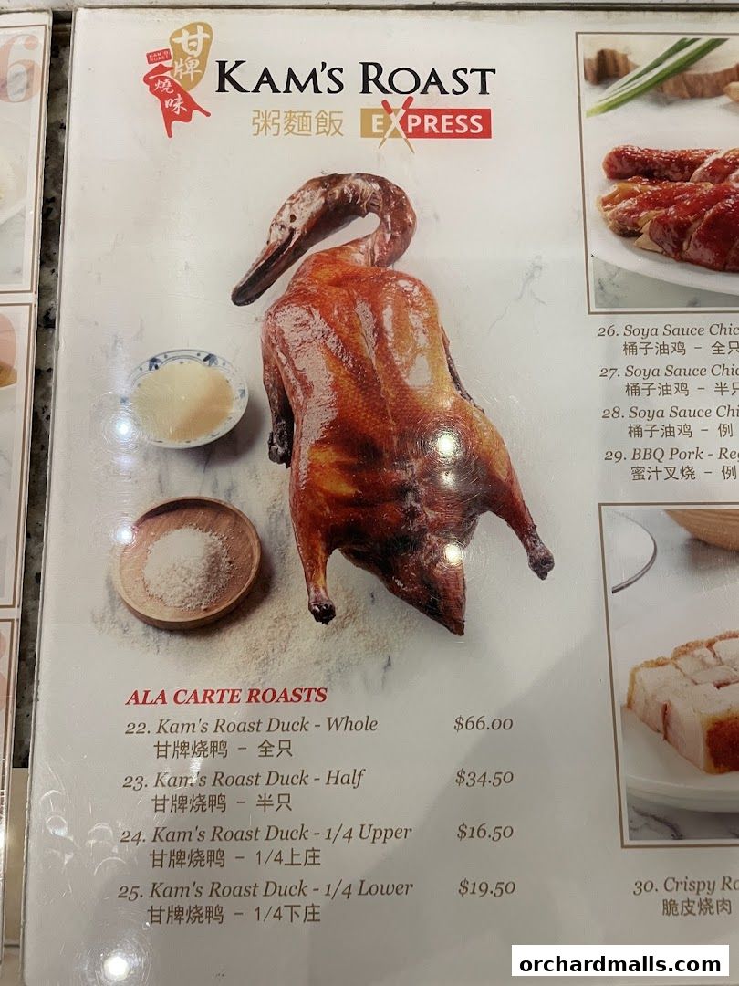 A menu featuring Kam's Roast Duck and other roasted meats with prices.