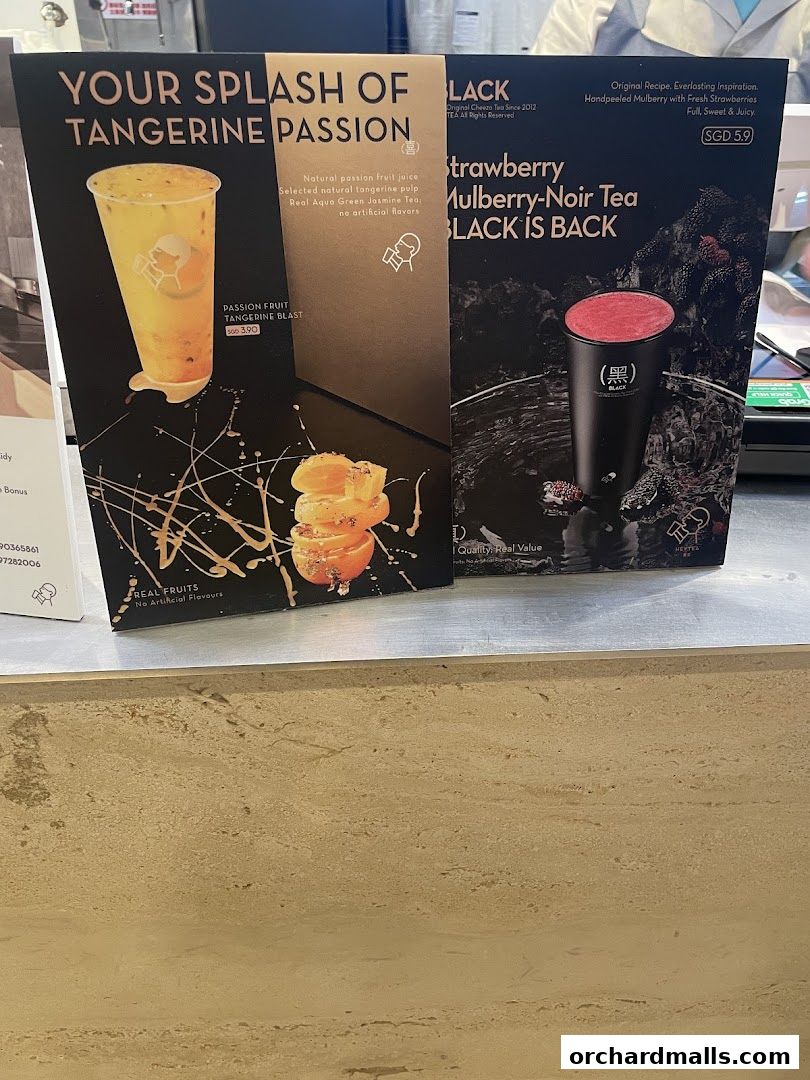 Promotional flyers for two drinks: Tangerine Passion and Strawberry Mulberry-Noir Tea.