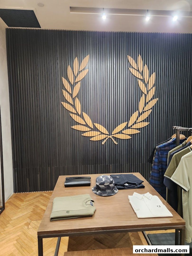 Fred Perry shop interior with clothing display and iconic laurel wreath logo.