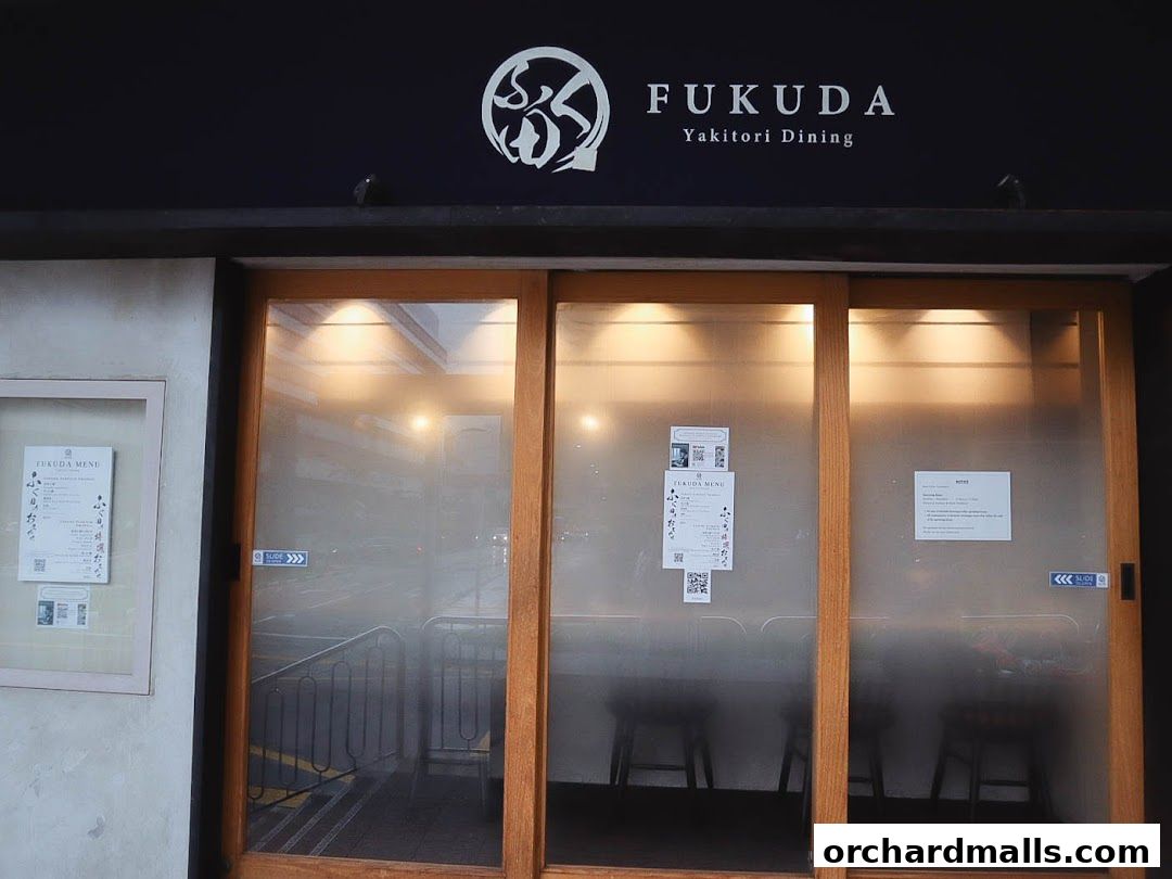 The entrance of FUKUDA Yakitori Dining Singapore with a menu displayed.